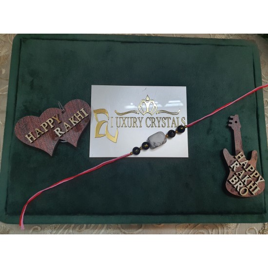 CRYSTAL RAKHI WITH Black Onyx and Howlite beads in Thread