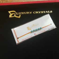 CRYSTAL Rakhi With Turquoise CRYSTAL Beads with Golden charm Beads in Thread