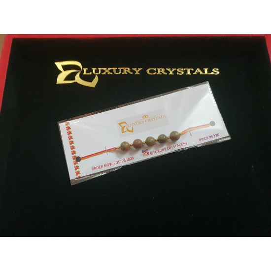 CRYSTAL Rakhi With Unakite CRYSTAL Beads with Golden Charm beads in Thread