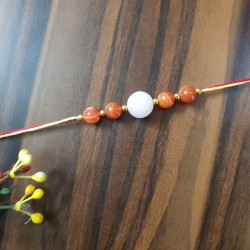 CRYSTAL Rakhi With Rose Quartz and Carlenian CRYSTAL Beads with Golden Charms in Thread