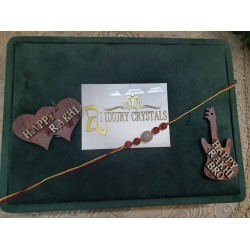 CRYSTAL Rakhi With Rose Quartz and Carlenian CRYSTAL Beads with Golden Charms in Thread