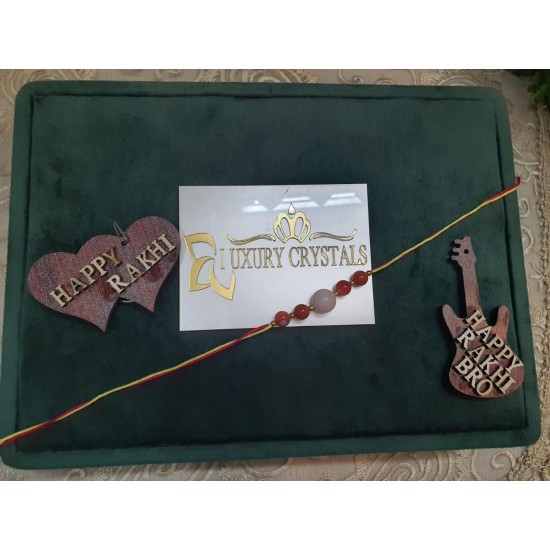 CRYSTAL Rakhi With Rose Quartz and Carlenian CRYSTAL Beads with Golden Charms in Thread