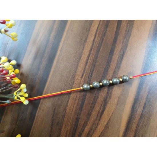 CRYSTAL Rakhi With Pyrite CRYSTAL Beads with Golden Charms Beads in Thread