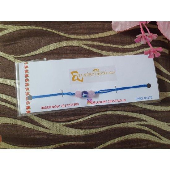 Rose Quartz crystal rakhi with evil eye