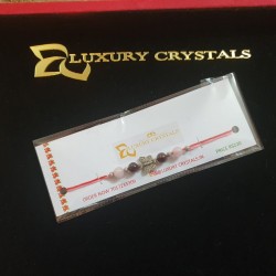 CRYSTAL Rakhi With Rose Quartz and Garnet with Silver Charms in Thread