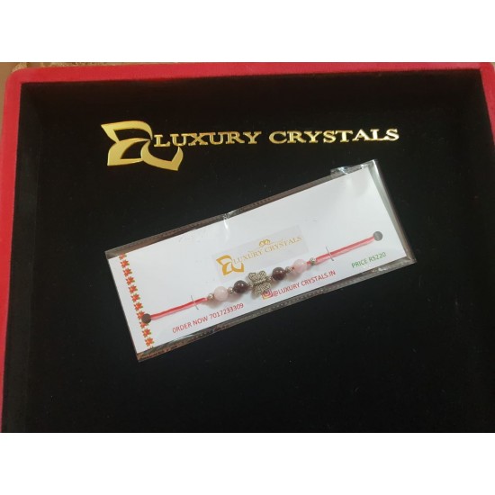 CRYSTAL Rakhi With Rose Quartz and Garnet with Silver Charms in Thread