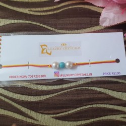 TURQUOISE CRYSTAL RAKHI WITH PEARL