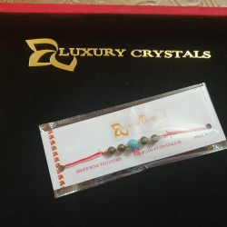 CRYSTAL Rakhi With Pyrite and Turquoise CRYSTAL Beads with Golden Charm beads in Thread