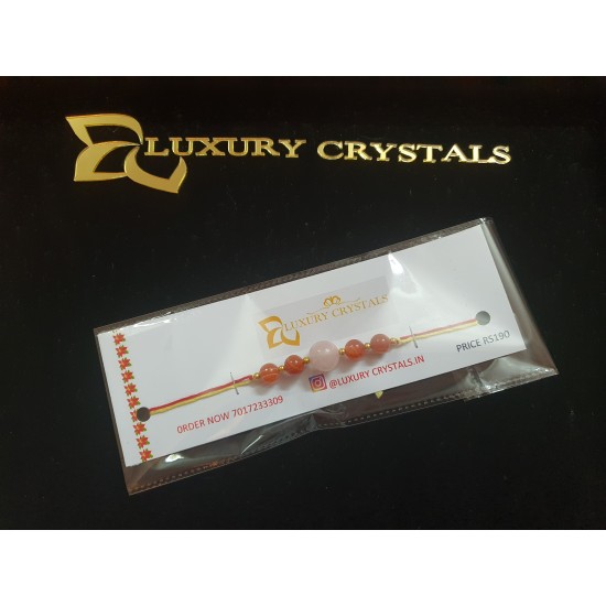CRYSTAL Rakhi With Rose Quartz and Carlenian CRYSTAL Beads with Golden Charms in Thread