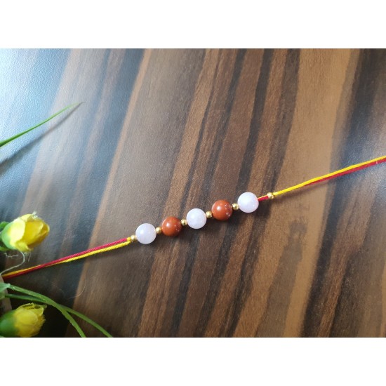 CRYSTAL Rakhi With Rose Quartz and Red Jasper CRYSTAL Beads in Thread With golden Charm beads