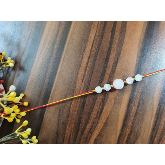 CRYSTAL Rakhi With Rose Quartz  with Selenite CRYSTAL Beads with Golden Charm Beads in Thread