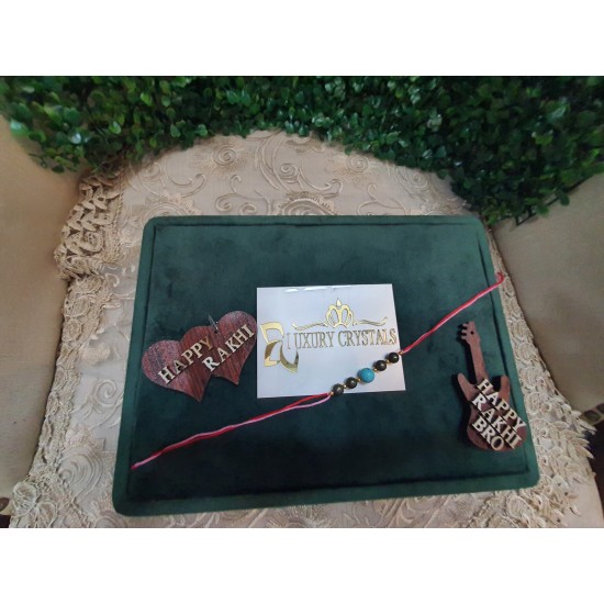 CRYSTAL Rakhi With Pyrite and Turquoise CRYSTAL Beads with Golden Charm beads in Thread