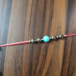 CRYSTAL Rakhi With Pyrite and Turquoise CRYSTAL Beads with Golden Charm beads in Thread