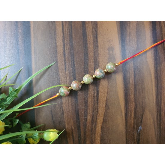 CRYSTAL Rakhi With Unakite CRYSTAL Beads with Golden Charm beads in Thread